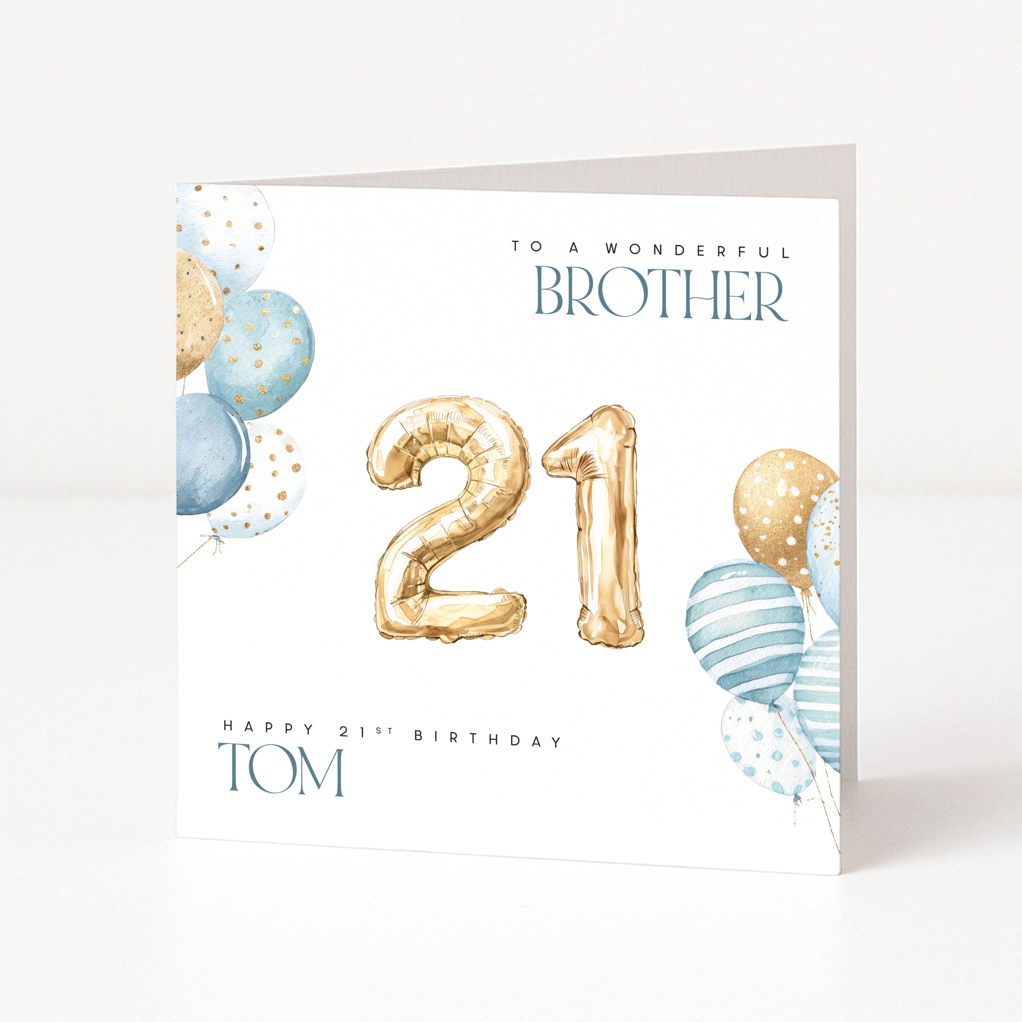 Birthday card for a brother with gold balloons and blue and white striped balloons on a white background