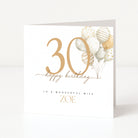 Birthday card with gold number '30', balloons, and 'happy birthday' text on a white background