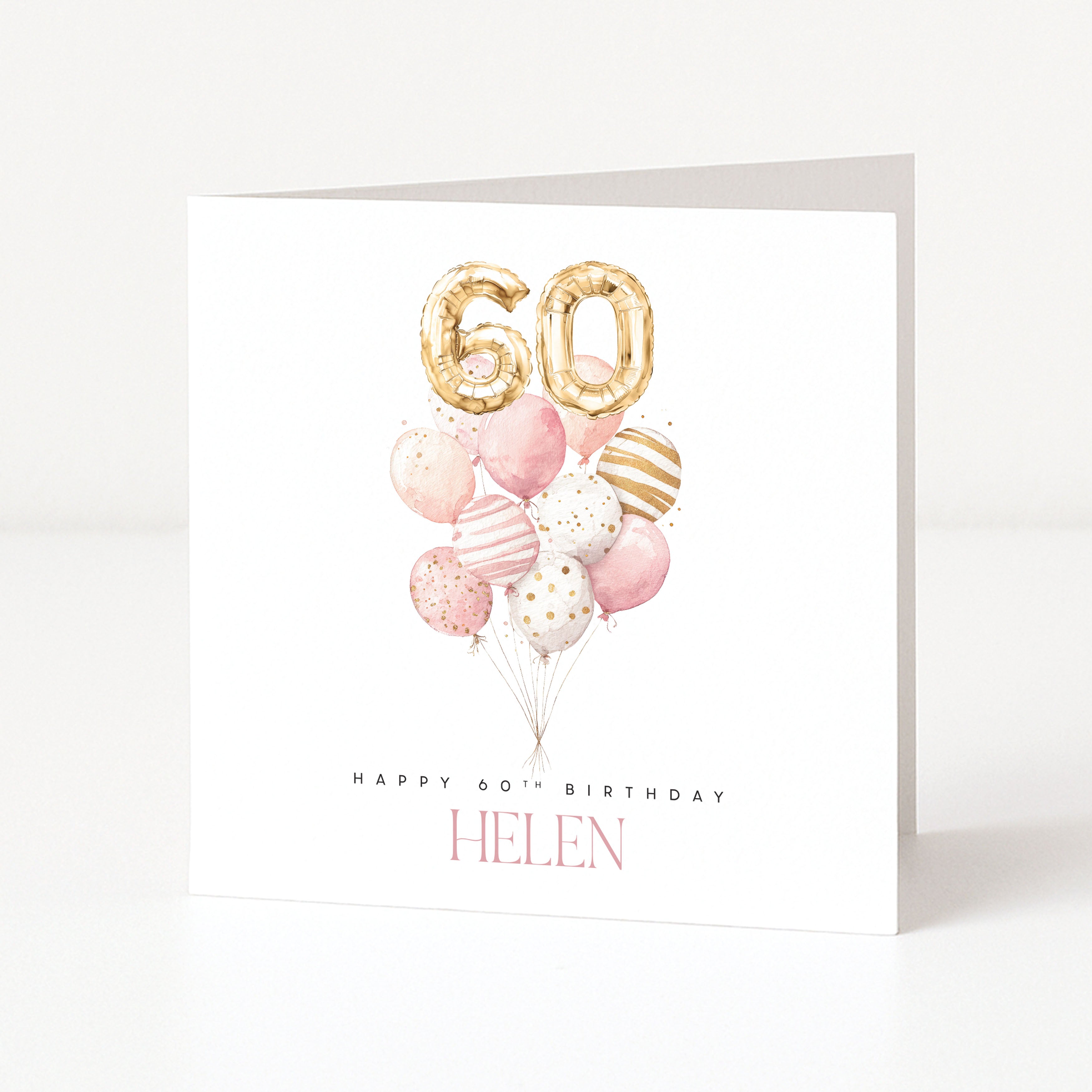 Personalised 60th birthday card with pink balloon arrangement, gold number balloons and the name Helen.