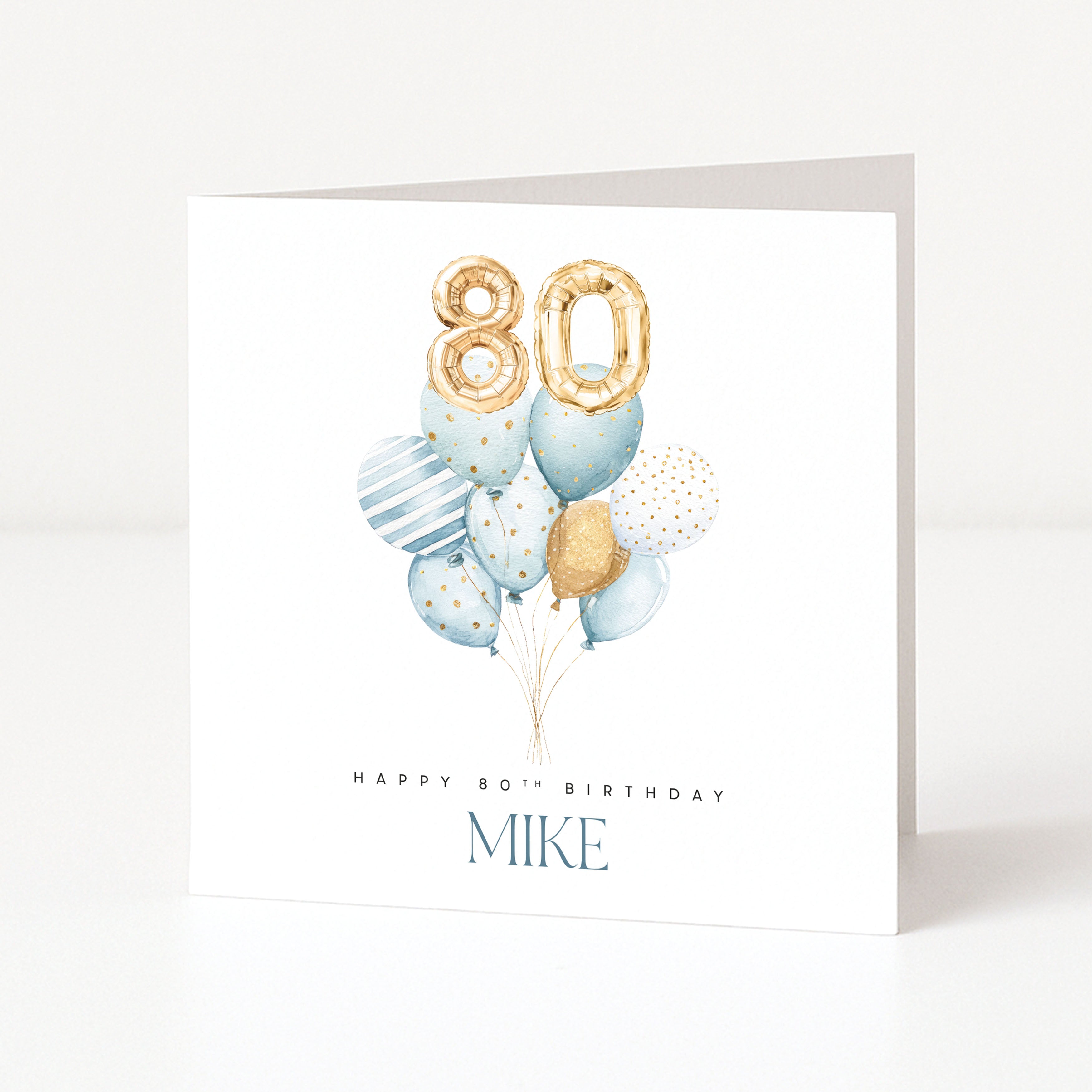 Personalised 80th birthday card for Mike with gold 80 balloons and a blue watercolour balloon bouquet.