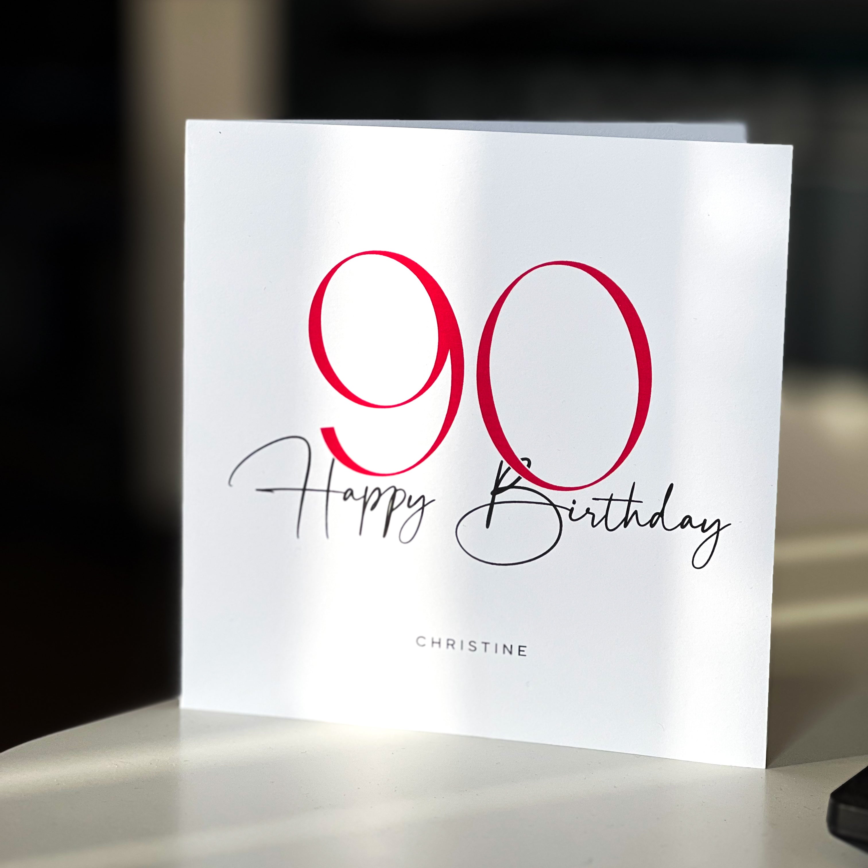 90th birthday card with red and black text on a white background