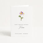 Greeting card with a primrose flower illustration and text for February birthday on a white background