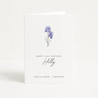 Greeting card with a watercolor illustration of larkspur flowers and text on a white background