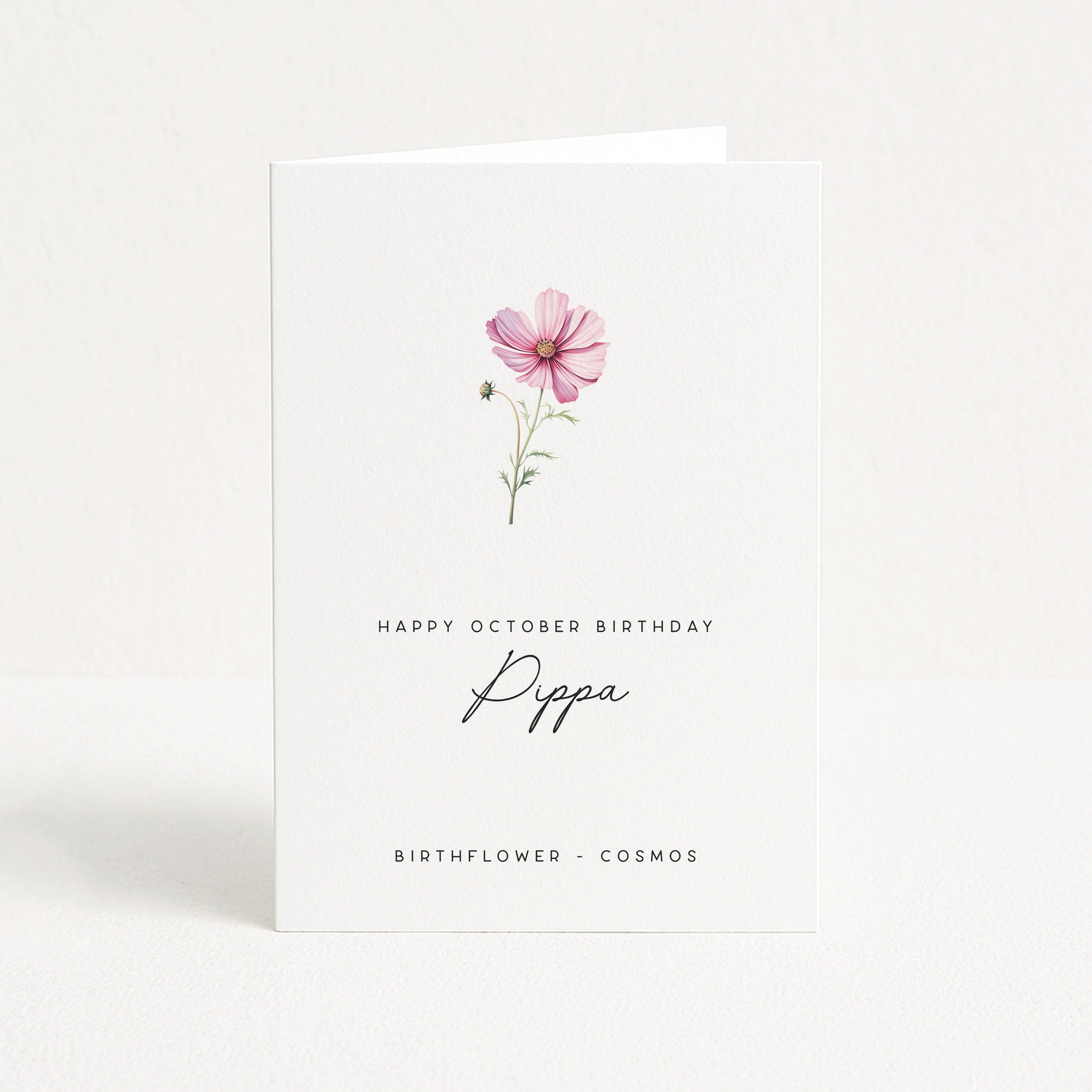 Greeting card with a pink flower illustration and birthday message on a white background