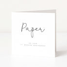 White card with 'Paper' and '1st Wedding Anniversary' text on a white background