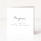 White card with black text 'Paper on your 1st wedding anniversary' on a white background