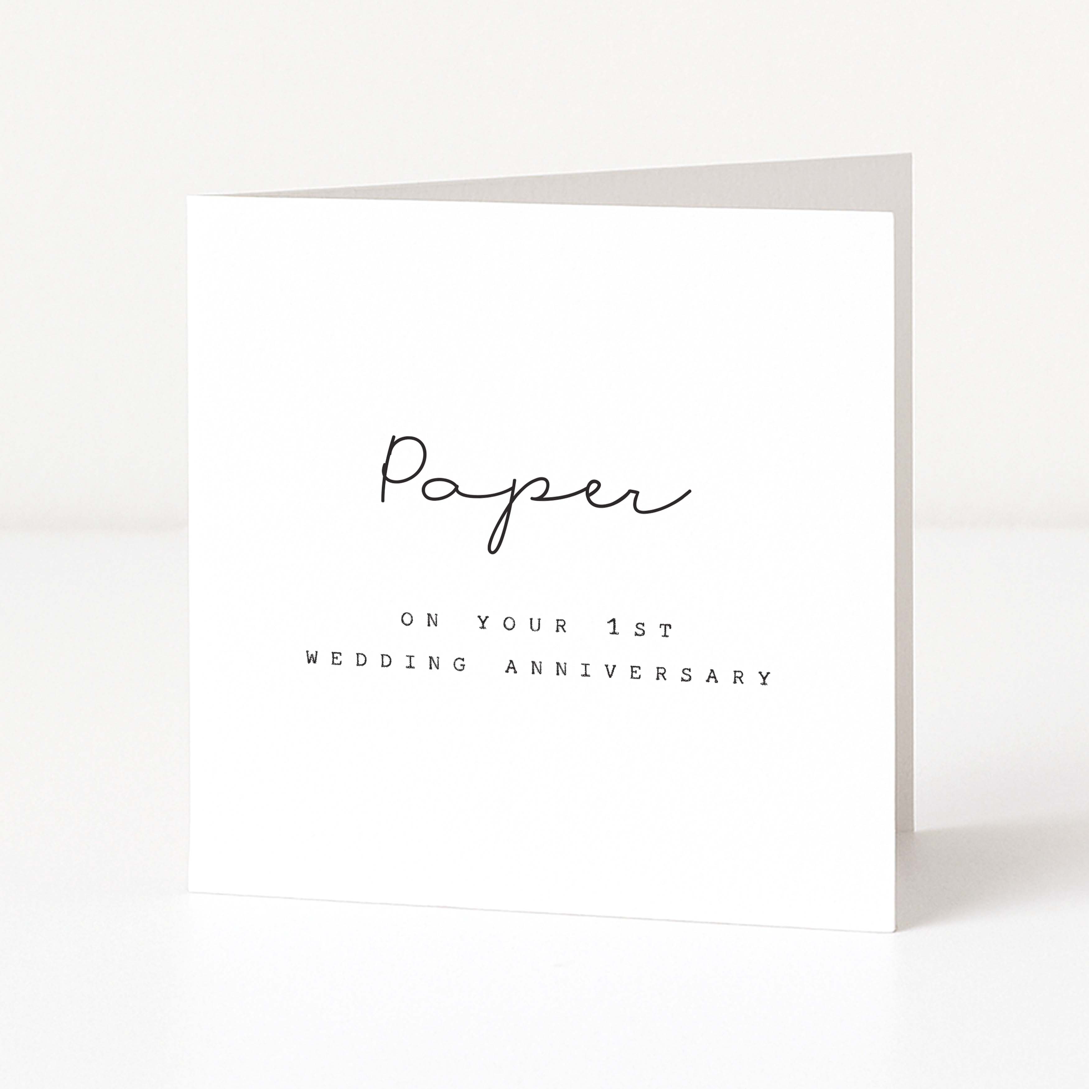 White card with black text 'Paper on your 1st wedding anniversary' on a white background