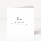 Greeting card with 'Tin on your 10th wedding anniversary' text on a white background