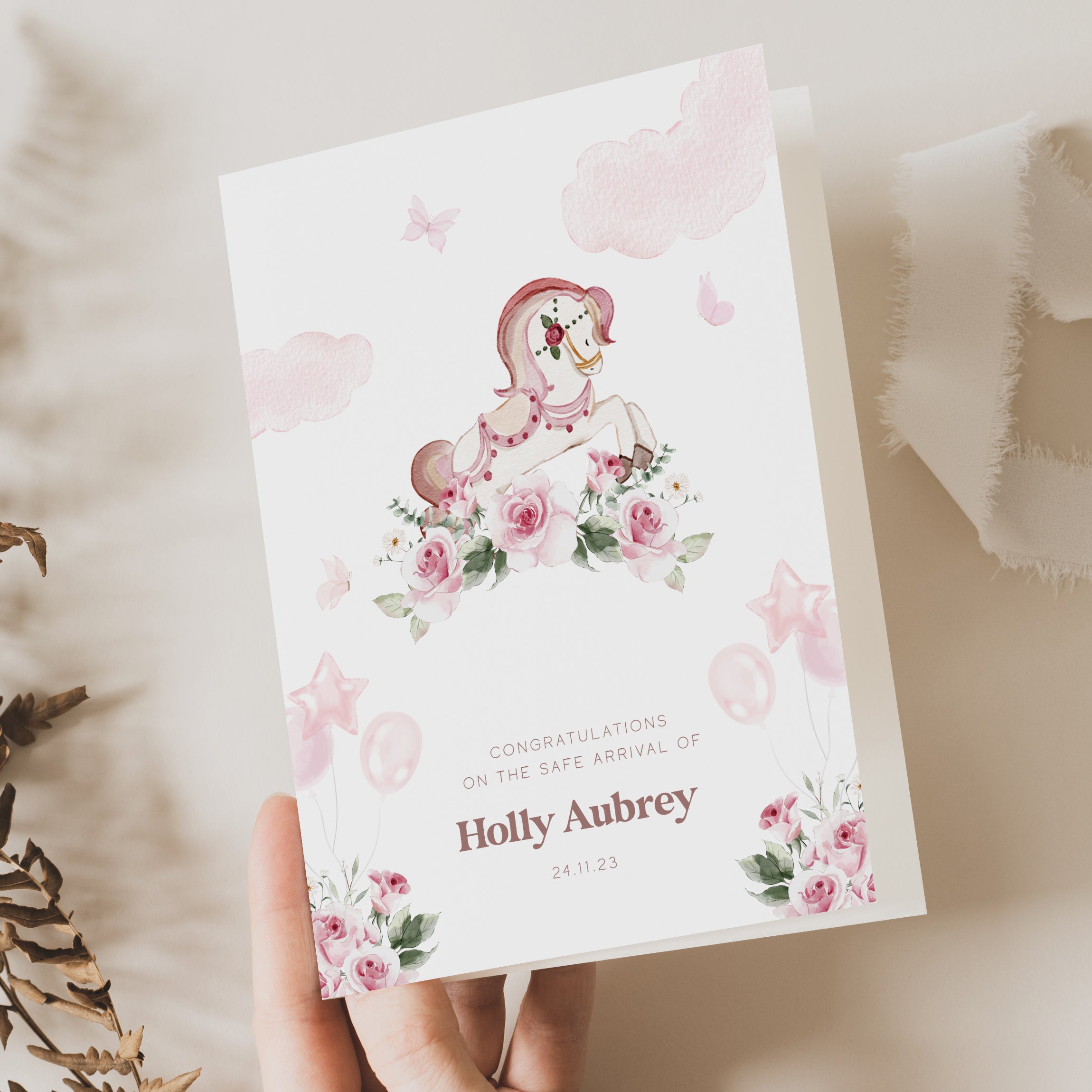 pink unicorn new baby girl card with name and birthdate on front