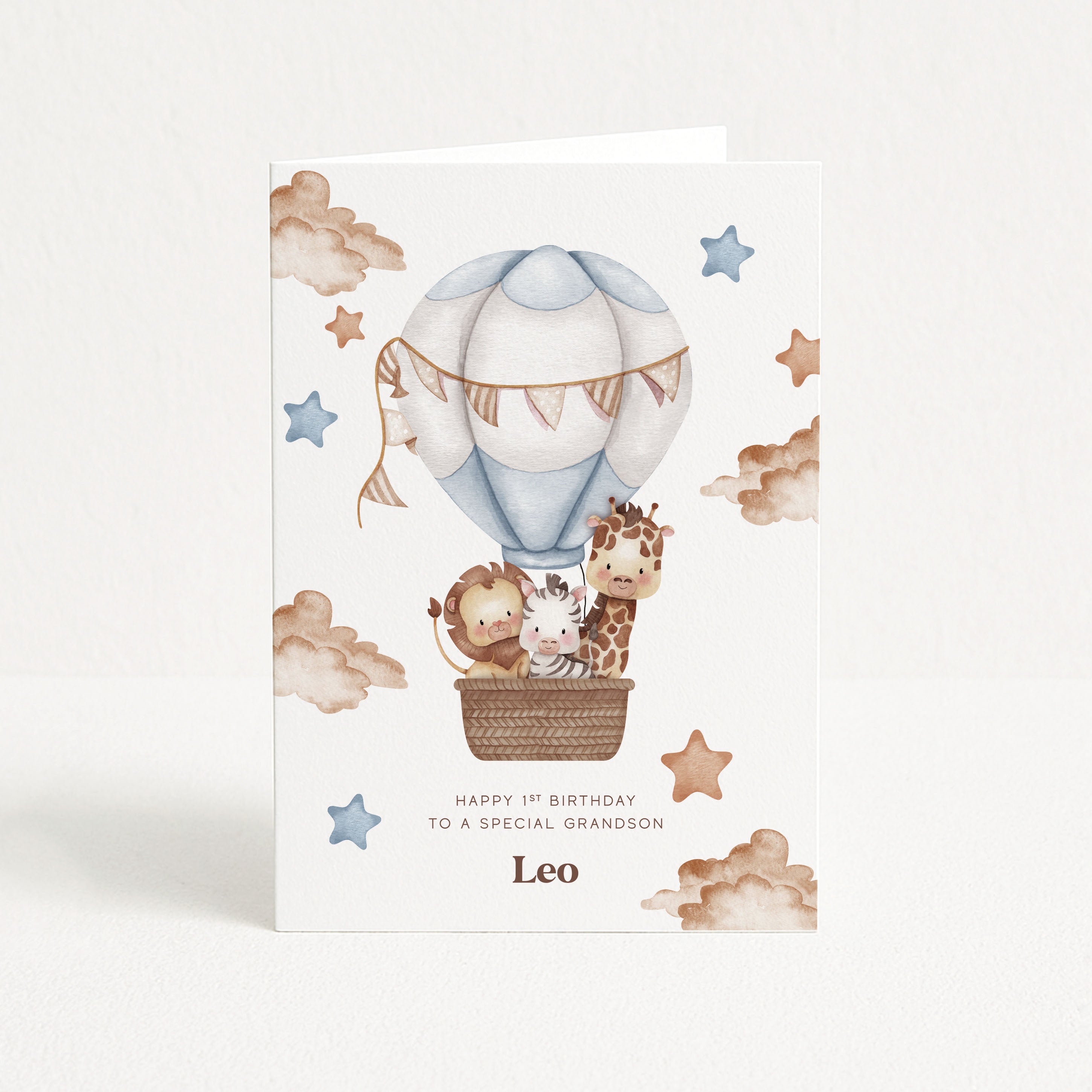Greeting card with animals in a hot air balloon on a white background