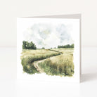 Greeting card with a watercolor design of a field and path on a white background