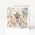 Greeting card with a watercolor illustration of a butterfly with floral wings on a light background