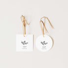 Two white tags with floral designs and 'A&P Thank You' text on a light beige background.