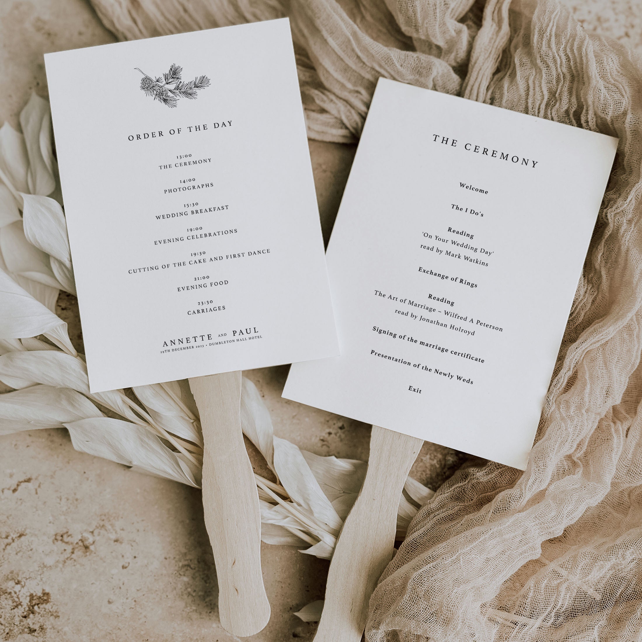 winter theme wedding paddle fans with wooden sticks on natural background