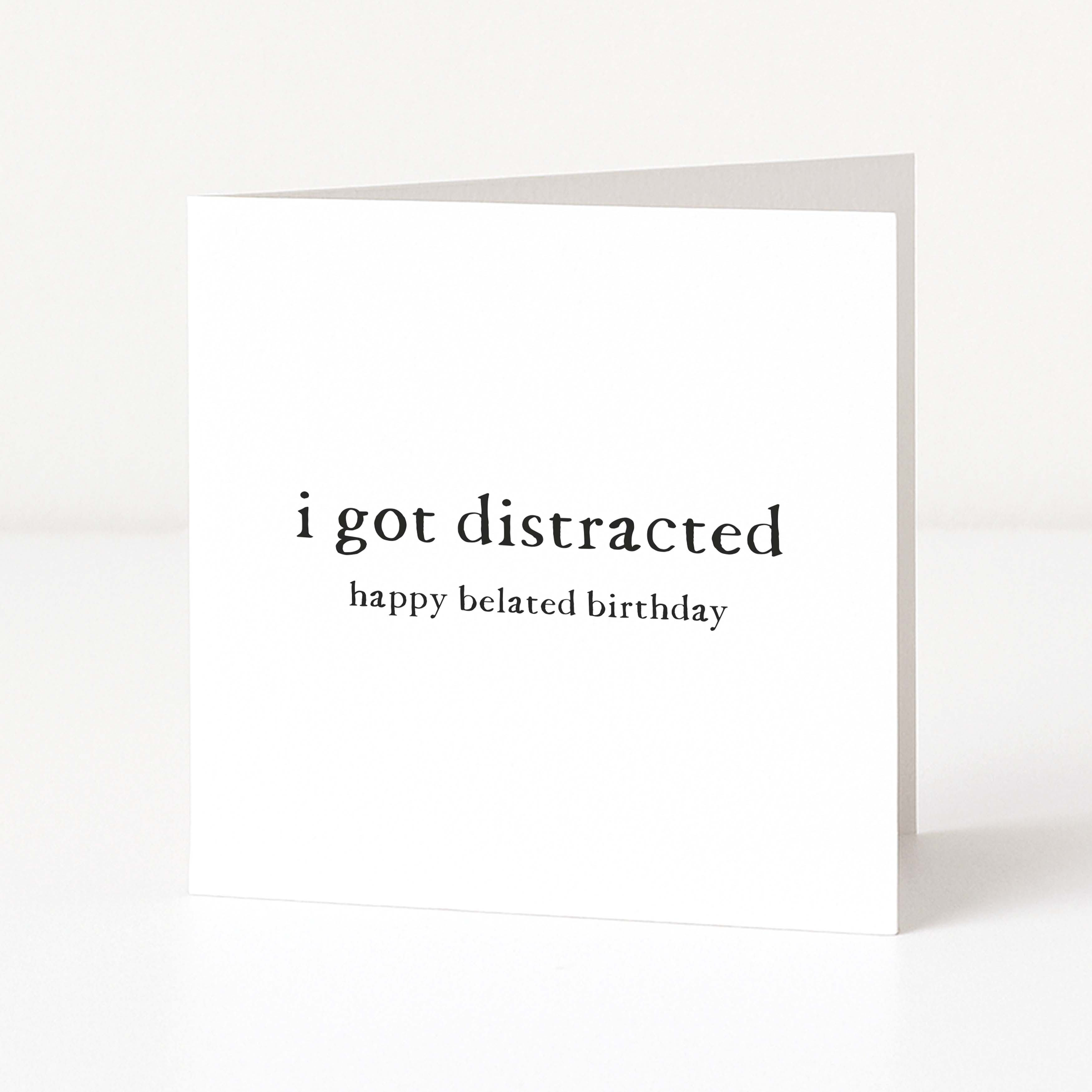 Greeting card with 'i got distracted happy belated birthday' text on a white background