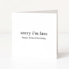 Greeting card with 'sorry i'm late happy belated birthday' text on a white background