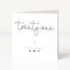 Greeting card with 'twenty-one' and 'Happy Birthday Amy' text on a white background