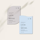 Two wedding save the date cards, one gray and one light blue, on a white background.