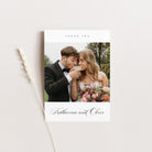 Wedding thank you card with a couple and flowers on a white background