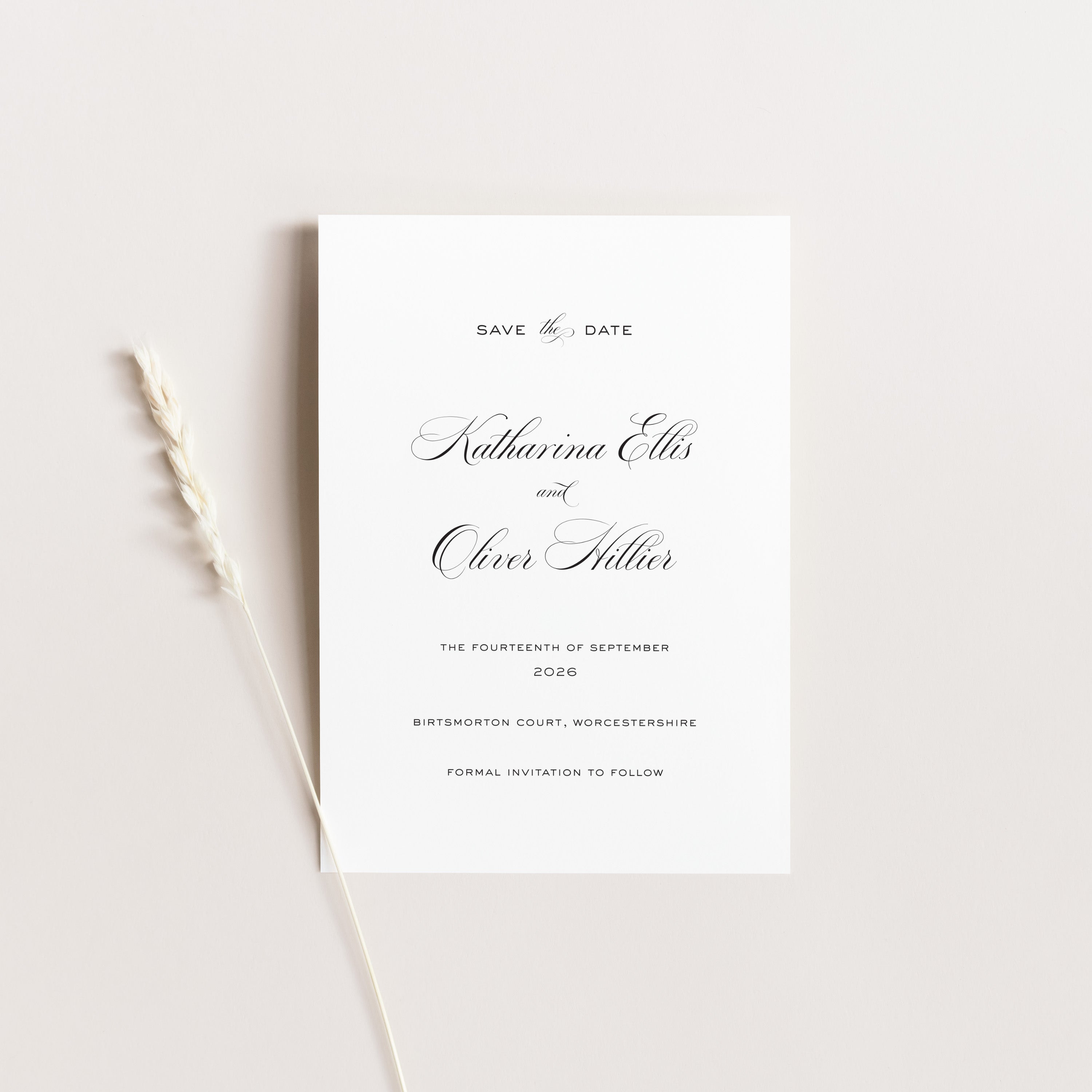 Save the date card with elegant black text on a white background