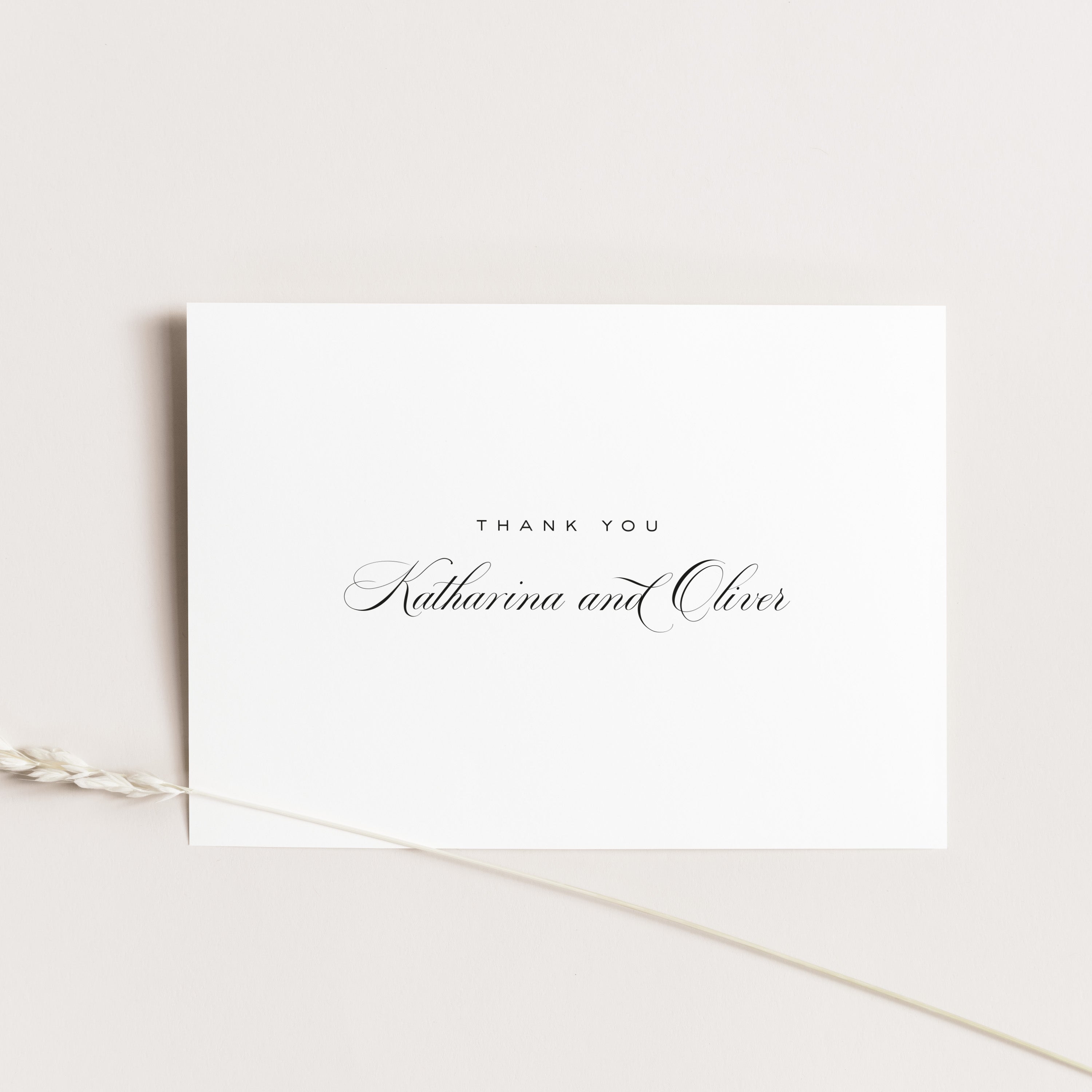 Wedding thank you  card with 'Thank you' and 'Katharina and Oliver' text on a light beige background