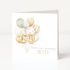 Personalised 60th birthday card with gold number balloons, balloon arrangement and recipient name on the front.