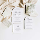Set of elegant wedding invitations on a soft fabric background
