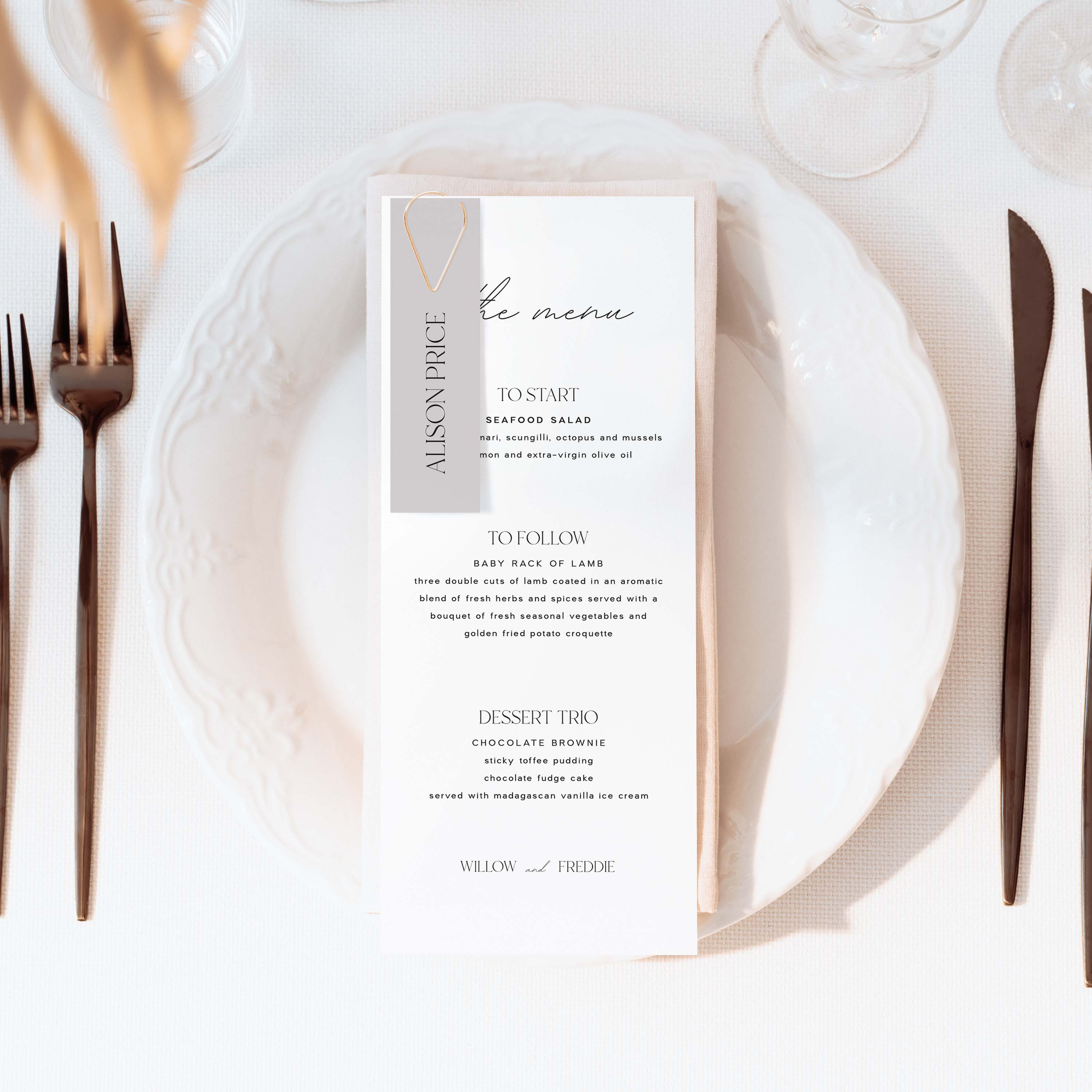 Menu card on a table setting with cutlery and plates