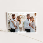 A square wedding thank-you card with a white border, featuring two side-by-side wedding photos of a couple, a central monogram design, and personalized names at the bottom, displayed on a light beige background with a decorative string.