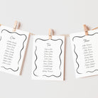 Hanging seating plan cards for a wedding with a whimsical design