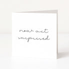 White card with black text 'now act surprised' on a white background