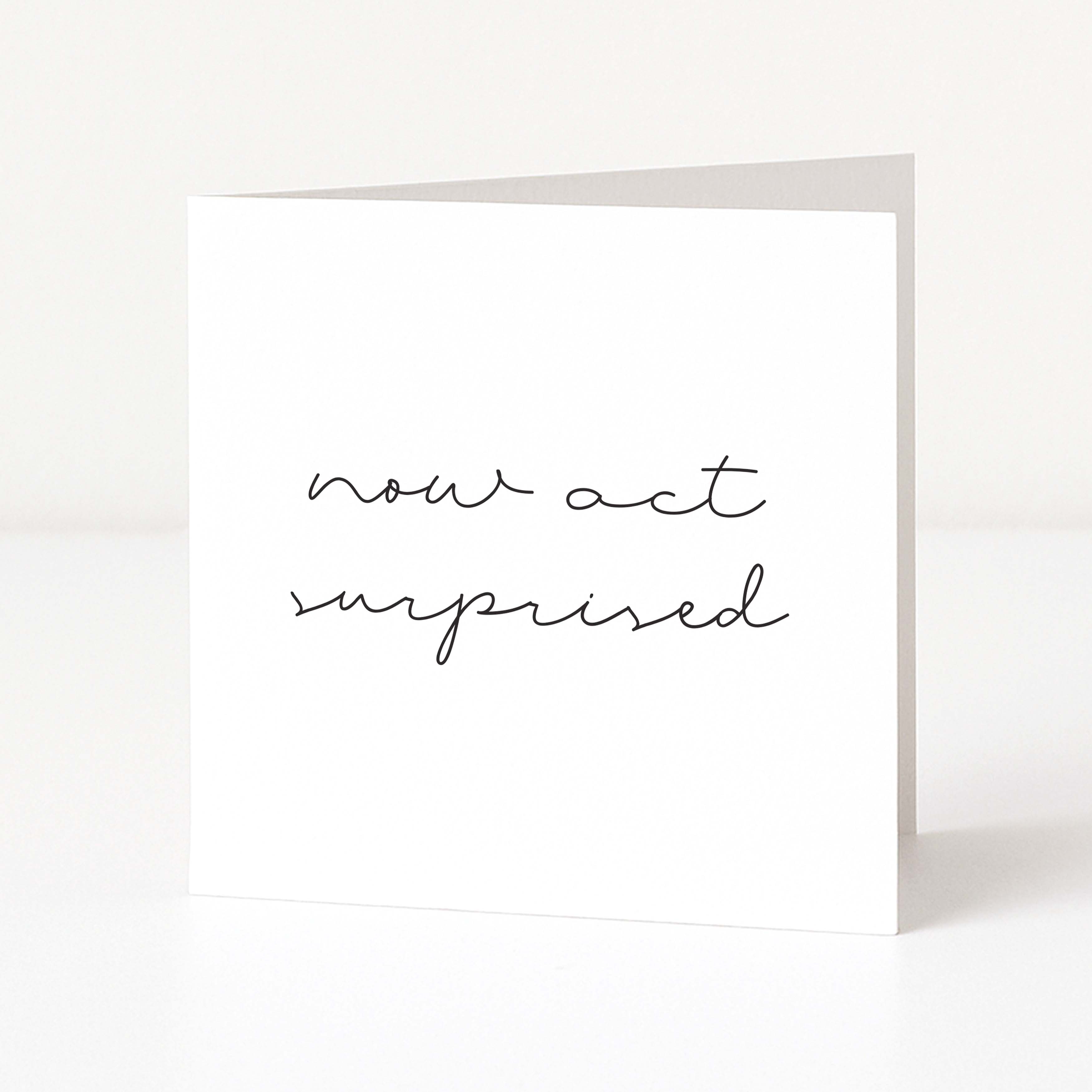 White card with black text 'now act surprised' on a white background