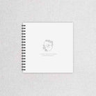 Wedding guest book with a monogram and floral crest