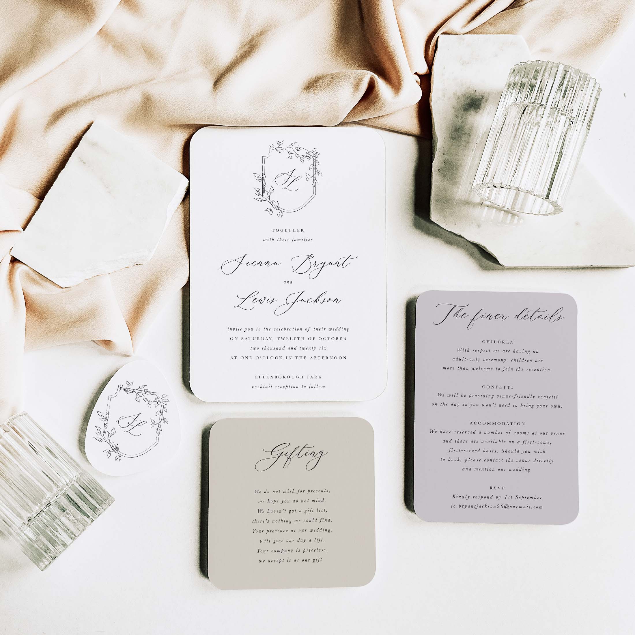 Wedding invitation set with elegant stationery on a soft fabric background