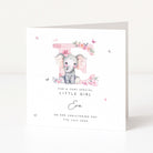 Personalised christening card for a girl with an elephant illustration and floral elements on a white background