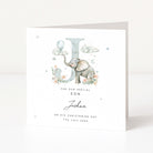Personalised christening card for a boy with an elephant and letter 'J' on a white background with black text
