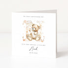Christening card with teddy bear illustration and personalized text on a white background