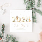 Christmas card with '2025 Merry Christmas' text, surrounded by pine branches and a white bow.