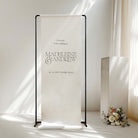 Wedding fabric welcome sign with 'Madeleine & Andrew' text in a minimalistic setting