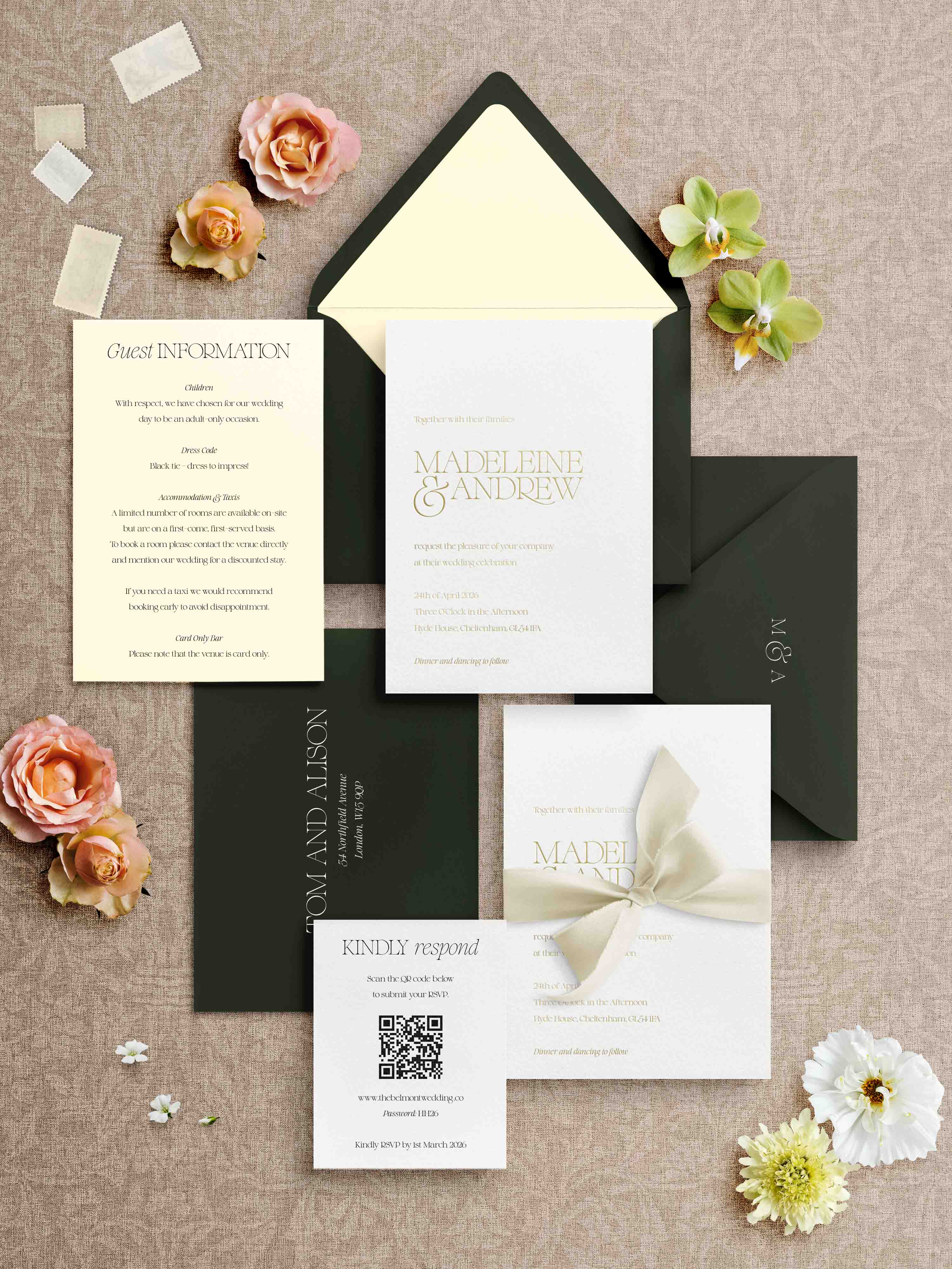 Foiled Wedding invitation set with envelopes and floral decorations on a textured surface