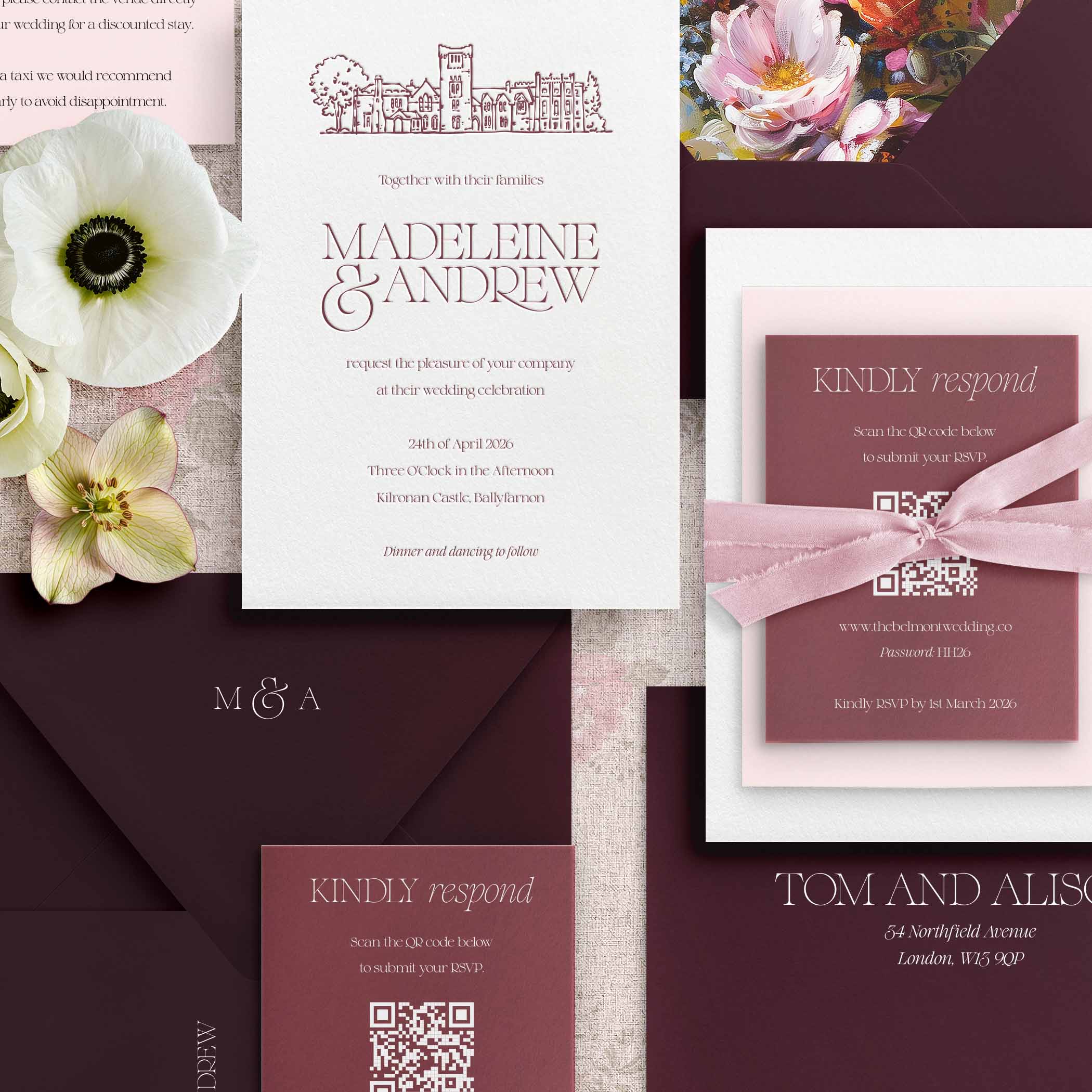Collection of letterpress wedding invitations with floral elements and stationery items.
