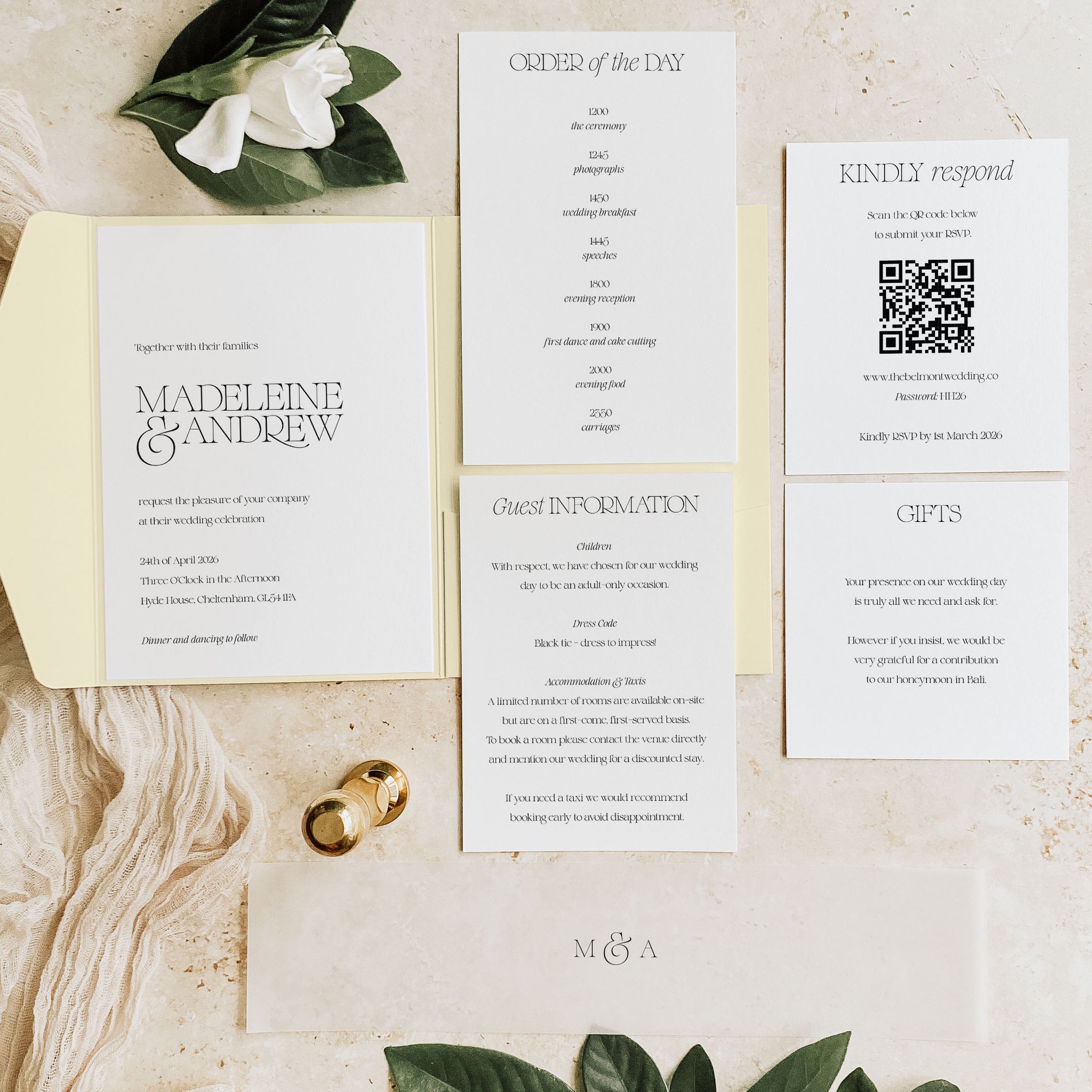 Wedding invitation set with RSVP card and order of the day on a wooden surface.