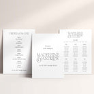 Three wedding signs (welcome sign, order of the day and table plan) on a light background