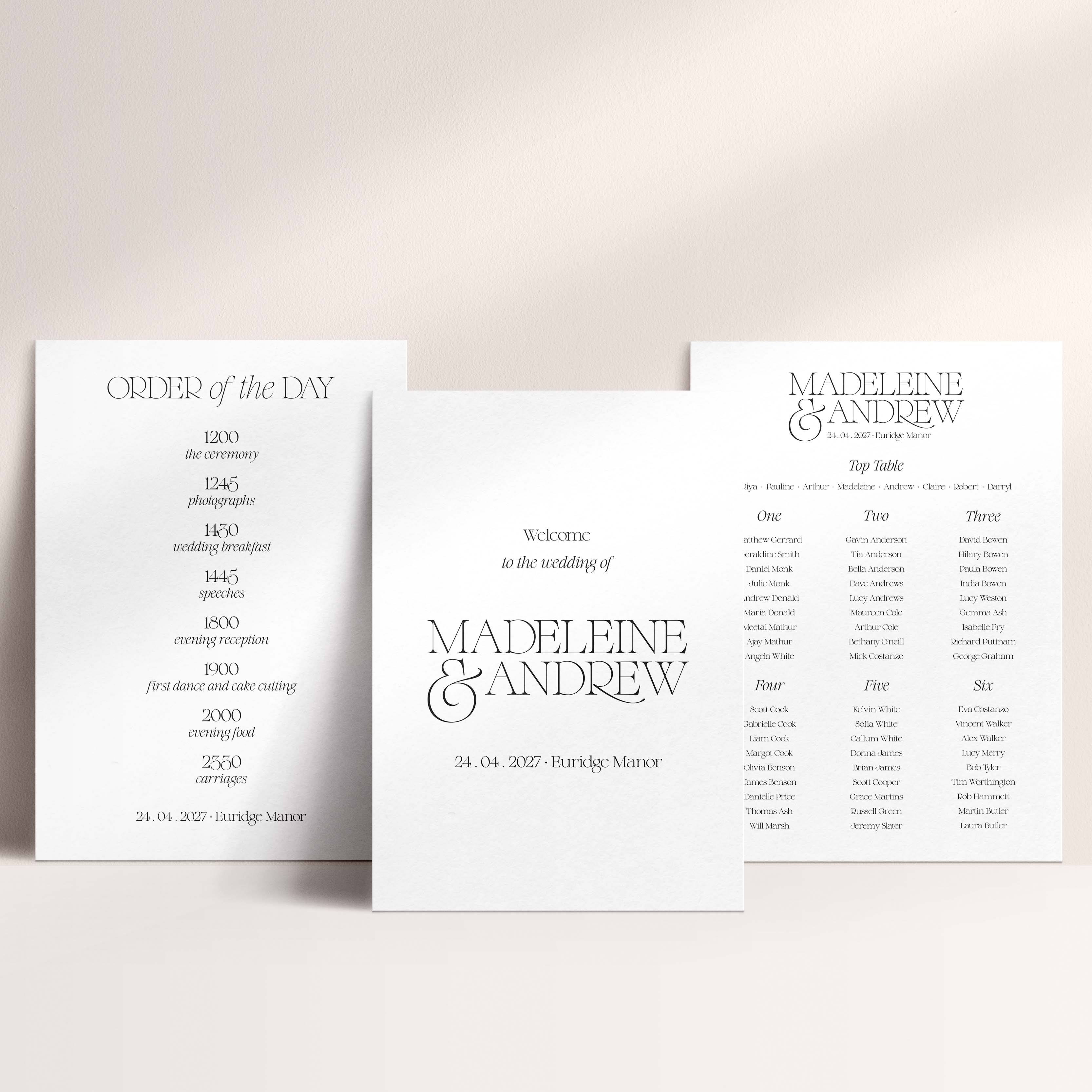 Three wedding signs (welcome sign, order of the day and table plan) on a light background