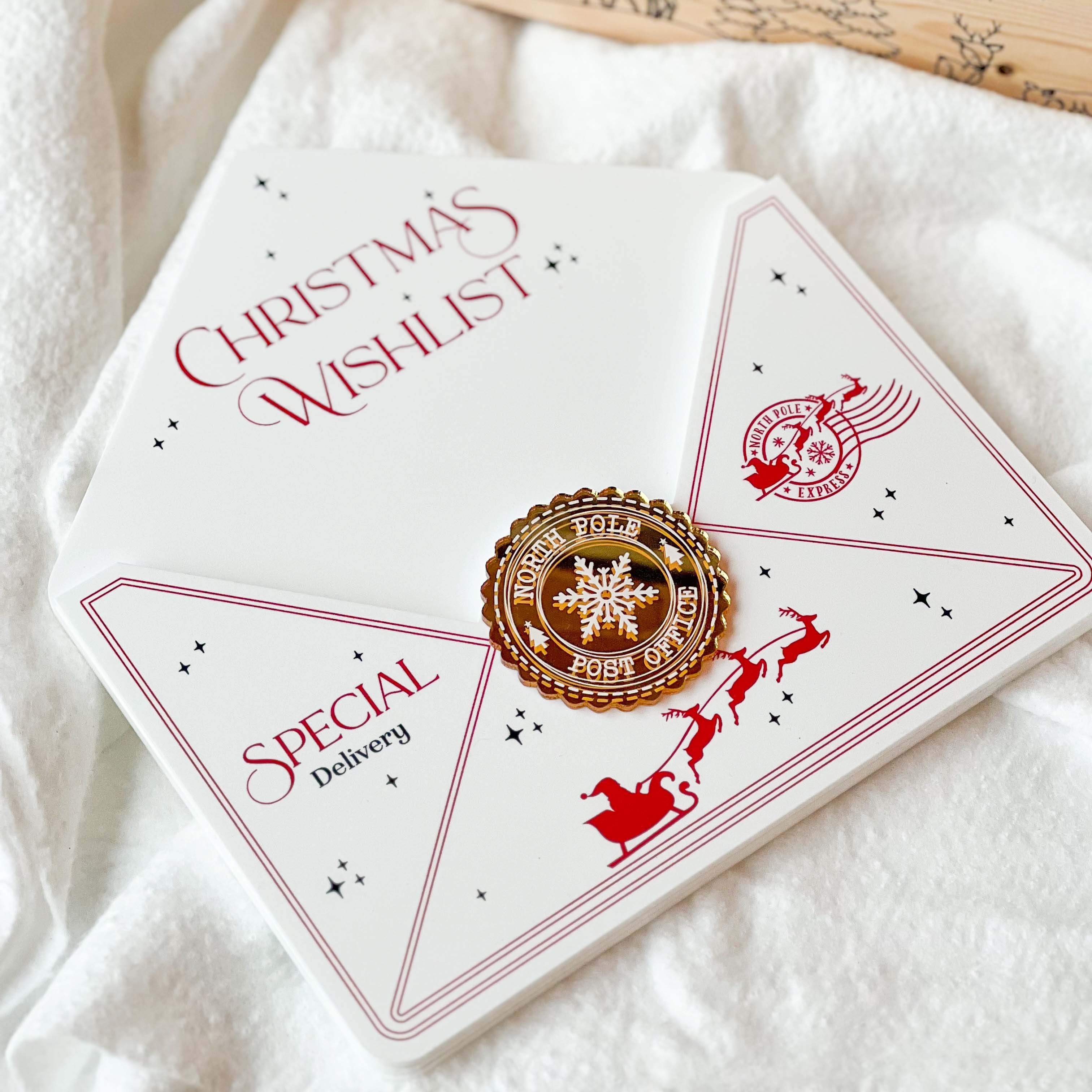 White envelope with red text and design, featuring a gold stamp on a white fabric background.