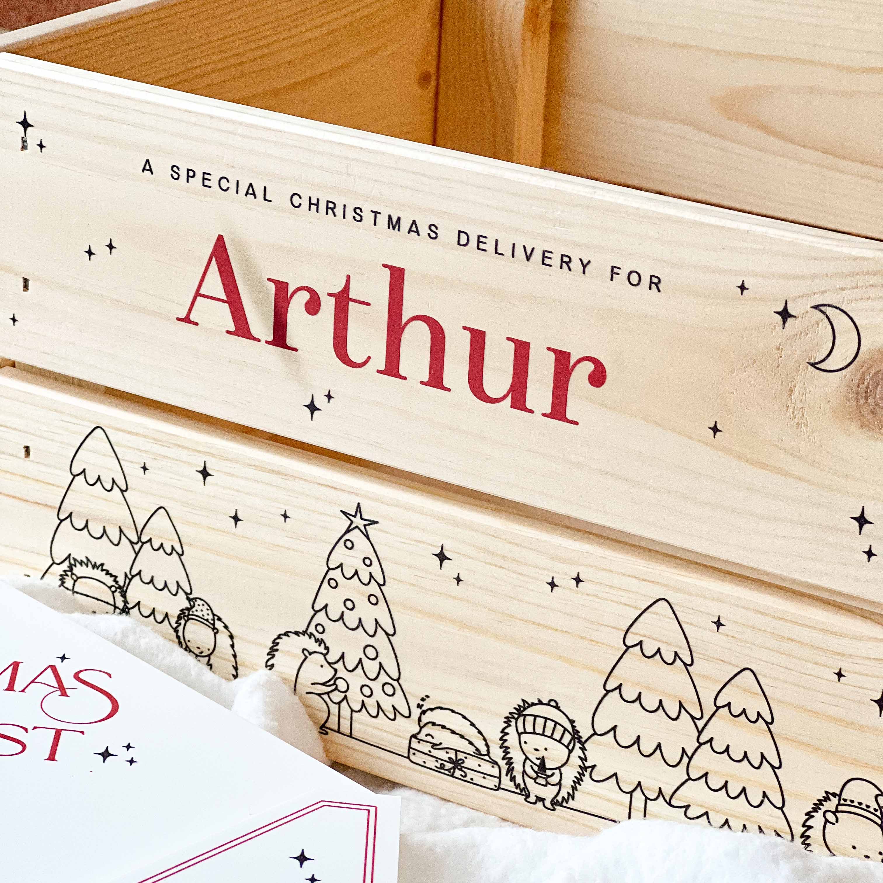 Wooden box with 'A Special Christmas Delivery for Arthur' text and festive illustrations.