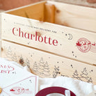 Wooden Christmas Eve box with personalised text and Christmas-themed design, featuring a Santa Claus stamp.