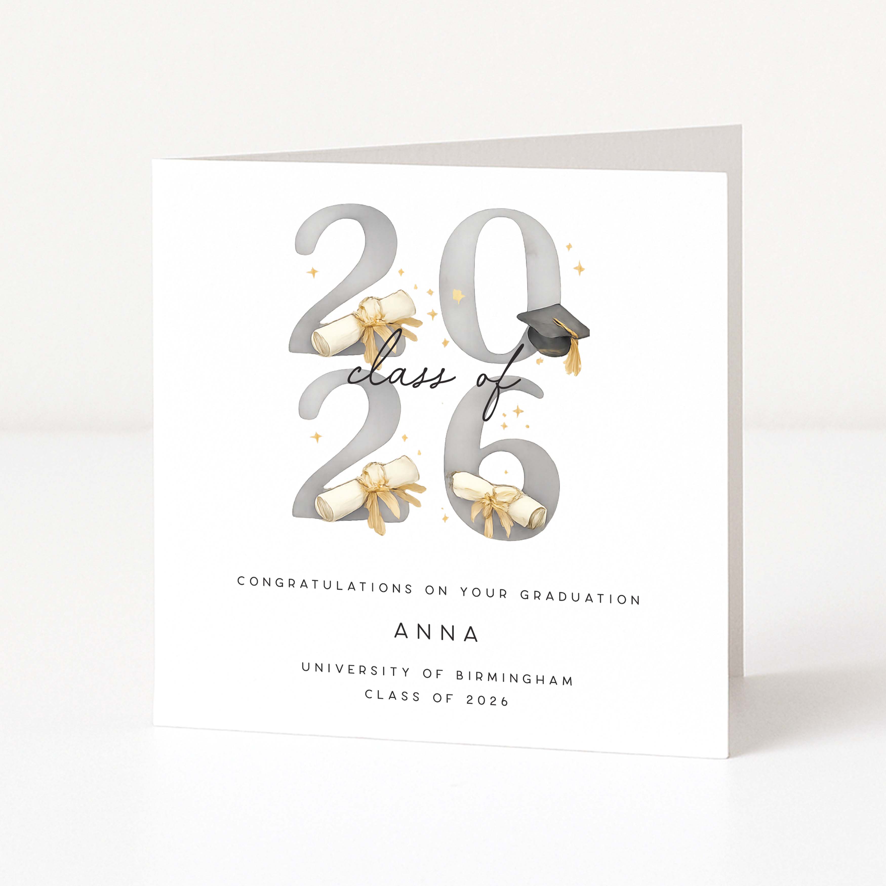 Graduation card with '2026' design, ribbons, and a cap on a white background