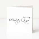 White card with 'congrats! on tying the knot' text on a white background