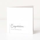 White card with 'Congratulations on your Wedding Day' text on a white background